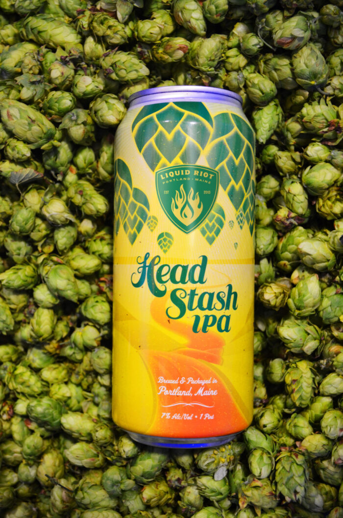 Head Stash can on pile of fresh hops
